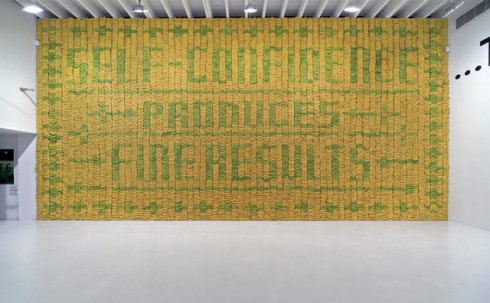 "At the opening of our exhibition at Deitch Projects in New York we featured a wall of 10,000 bananas. Green bananas created a pattern against a background of yellow bananas spelling out the sentiment: Self-confidence produces fine results.After a number of days the green bananas turned yellow too and the type disappeared."