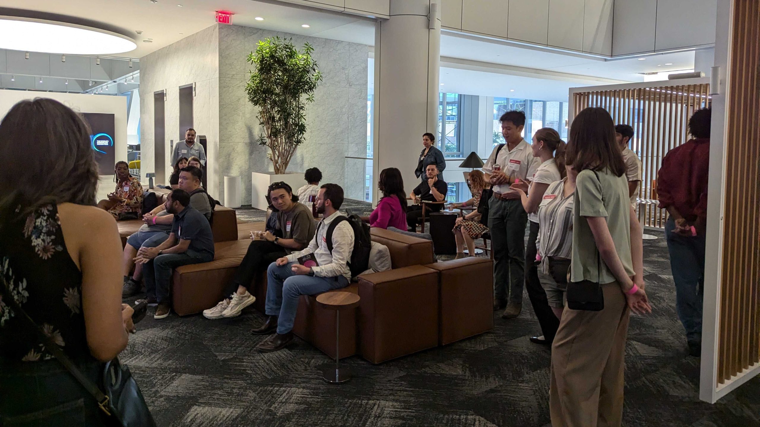 Attendees listen to a studio's presentation